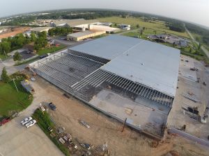 Arial view of a large warehouse building during construction