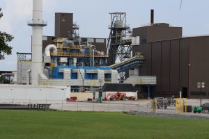 Owens Corning building exterior with smokestack