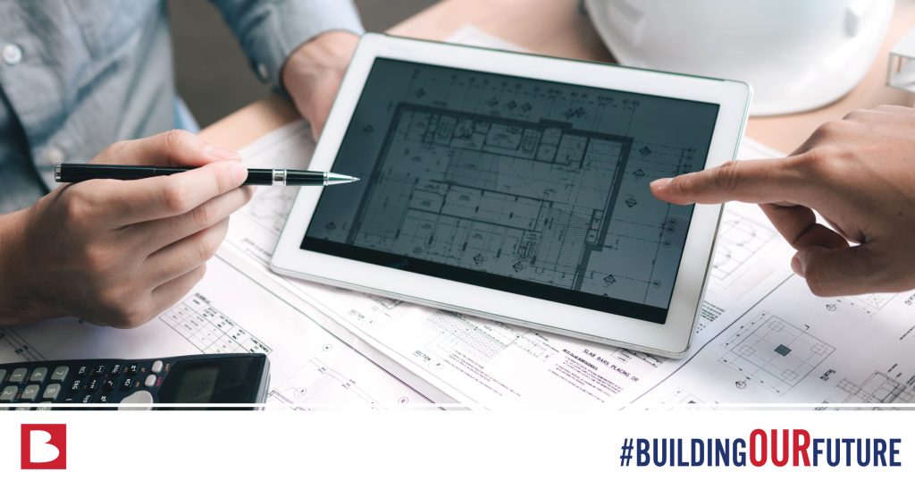 hands pointing at a tablet with a floorplan on it