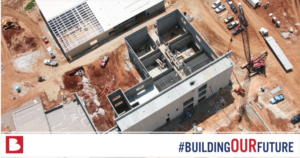 aerial of building construction with the hashtag #buildingourfuture