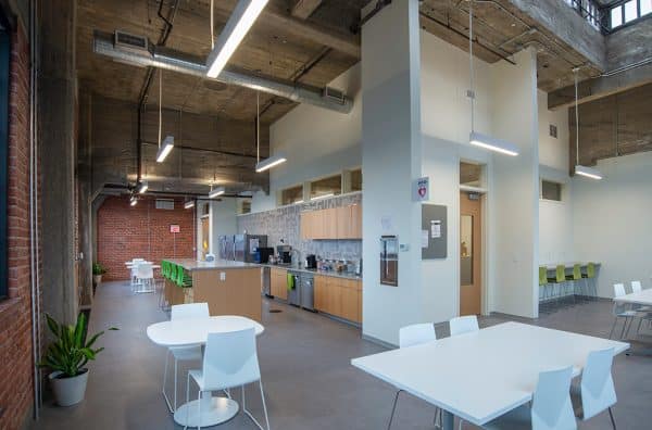 kitchen area with tall ceilings and lots of natural light