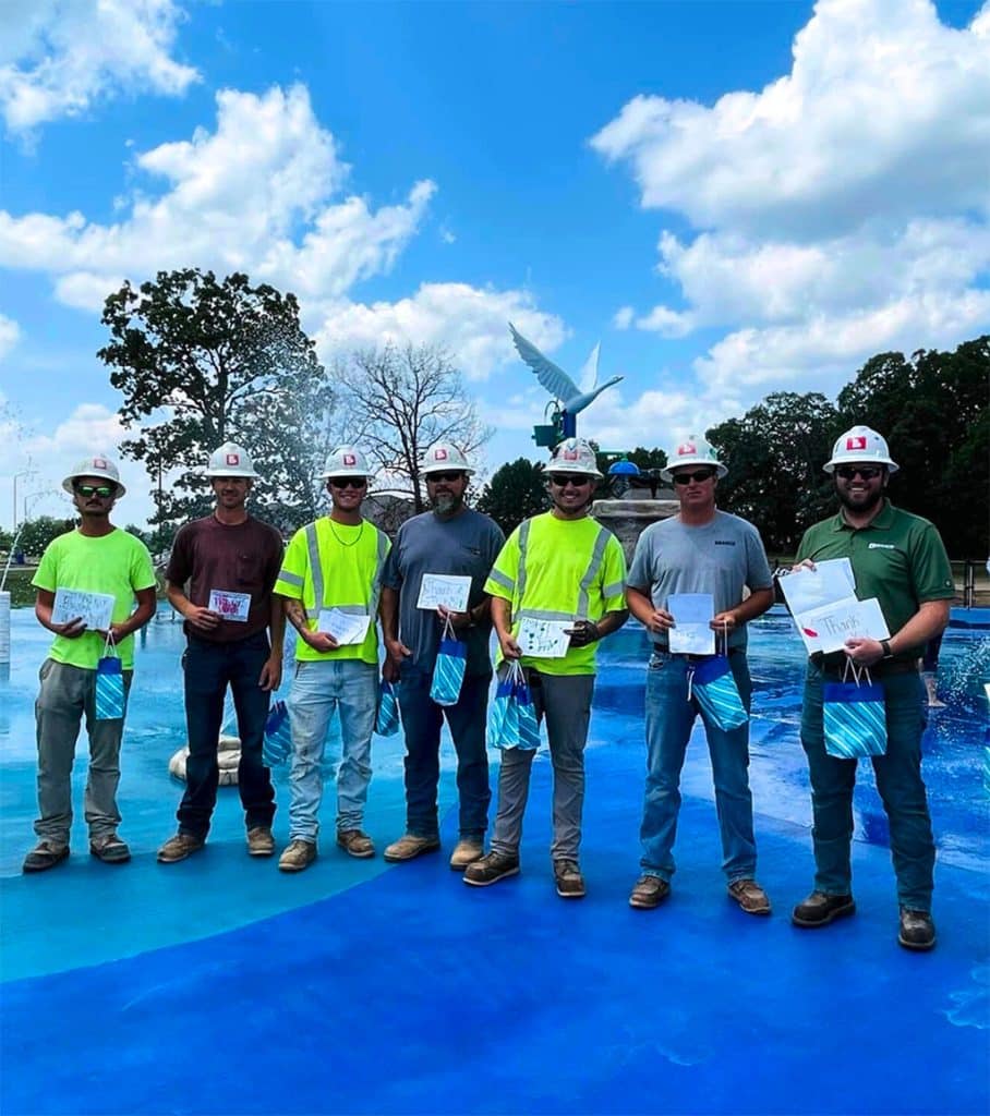 group of workers with thank you cards
