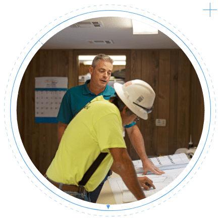 Workers reviewing plans together
